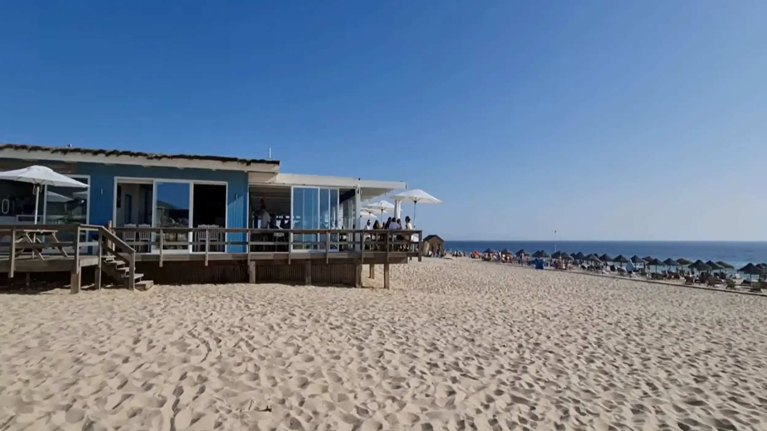 Blue beachfront restaurant with wooden deck on the Comporta Coast