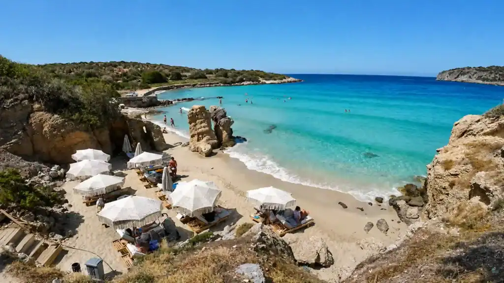Voulisma Beach sunbeds and turquoise cove, one of the beaches near Agios Nikolaos