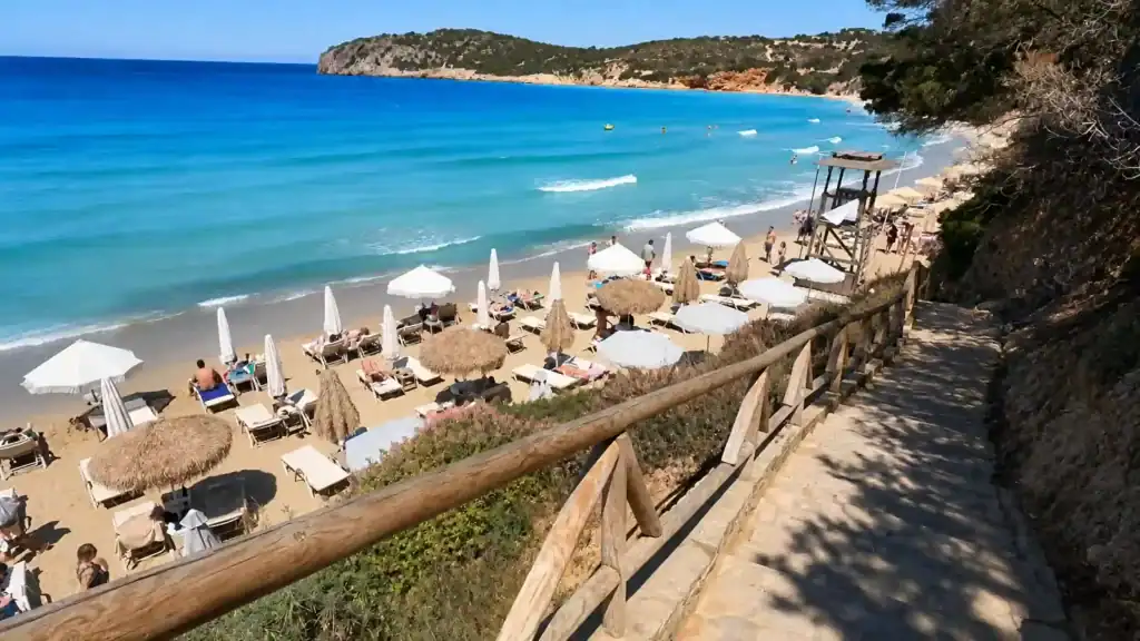 Thatched umbrellas and sunloungers along Voulisma Beach, one of the best beaches in East Crete