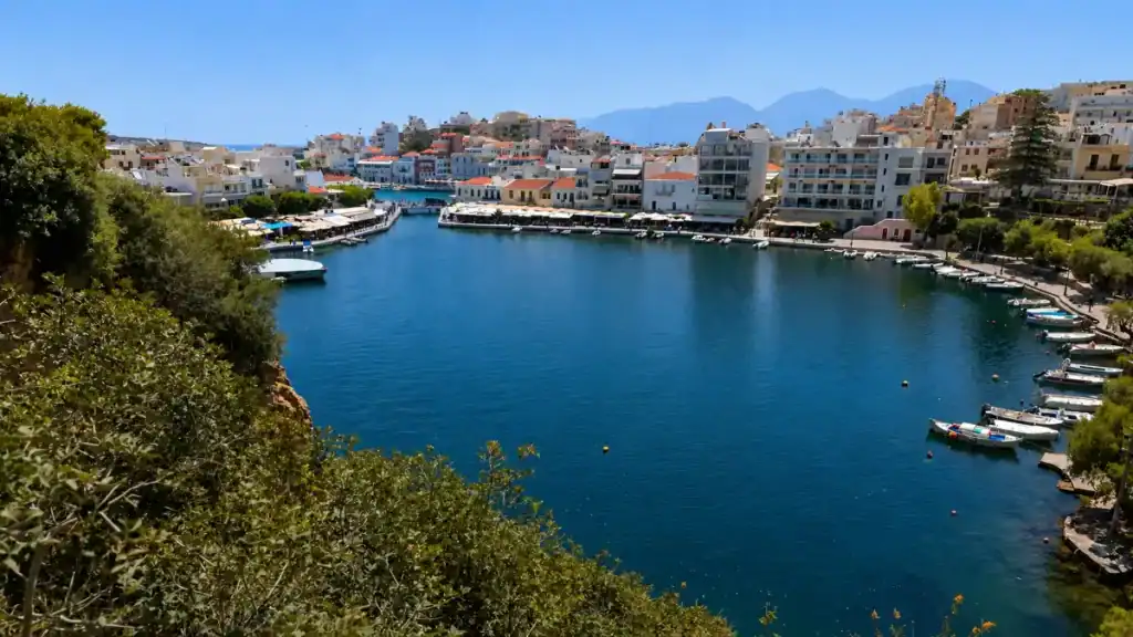 Lake Voulismeni ringed by tavernas and fishing boats, an East Crete travel guide highlight.
