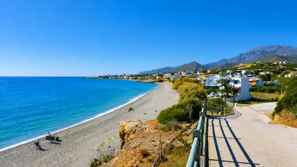 Curving beachfront and seaside houses at Makry Gialos in East Crete Travel Guide