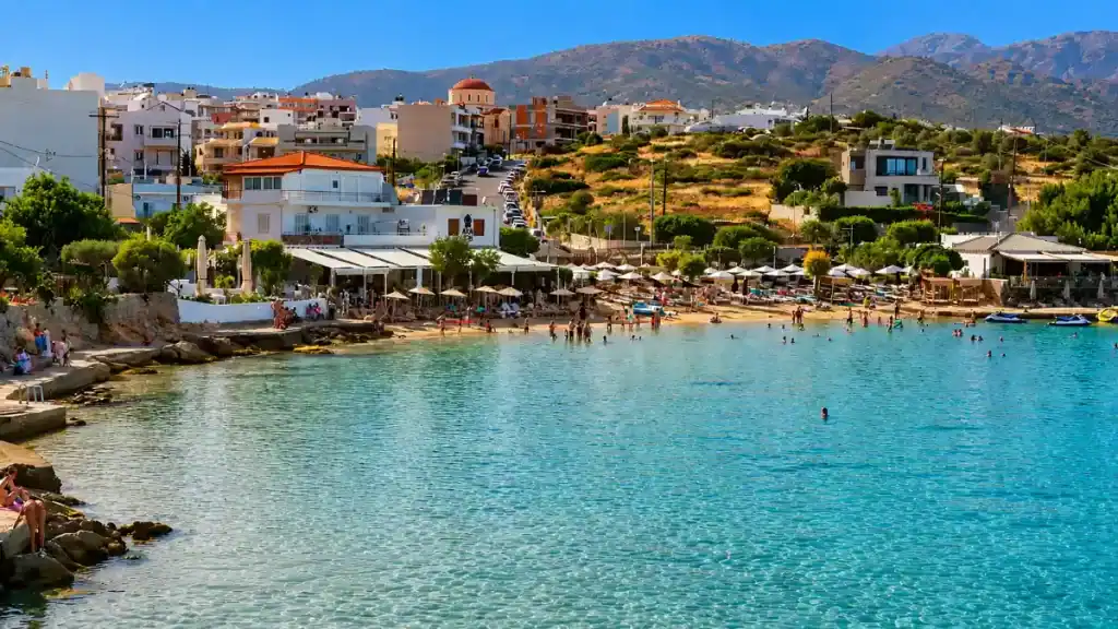 Swimmers and sun loungers at Ammoudi Beach, an early stop on the Agios Nikolaos to Sitia coast