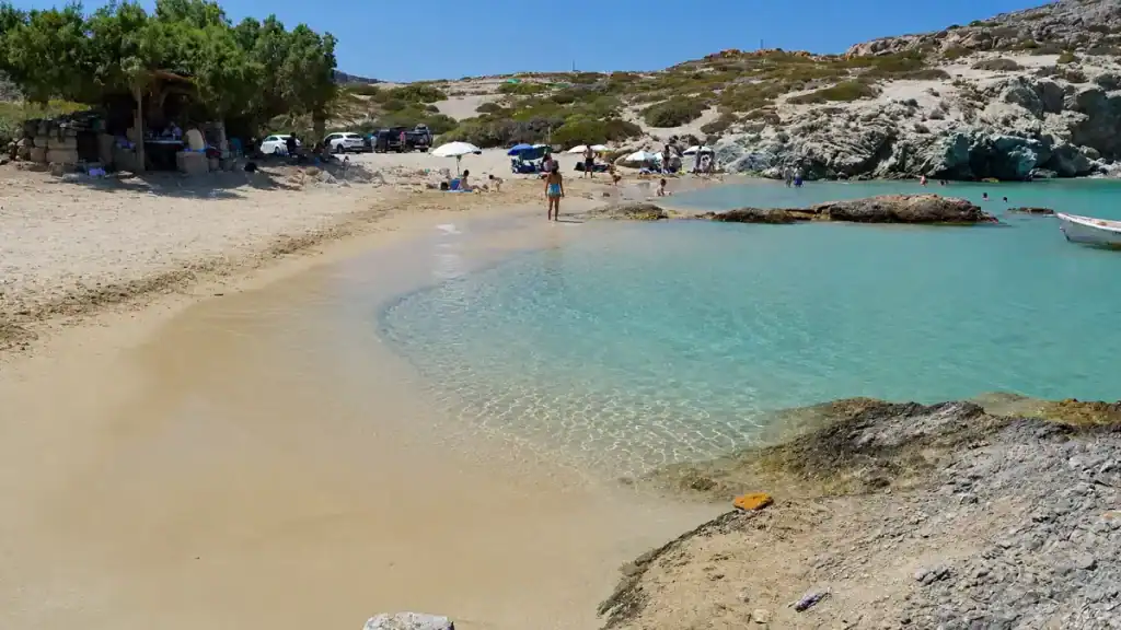 Clear shallow water and pale sand at Itanos beach, one of the beaches near Vai beach