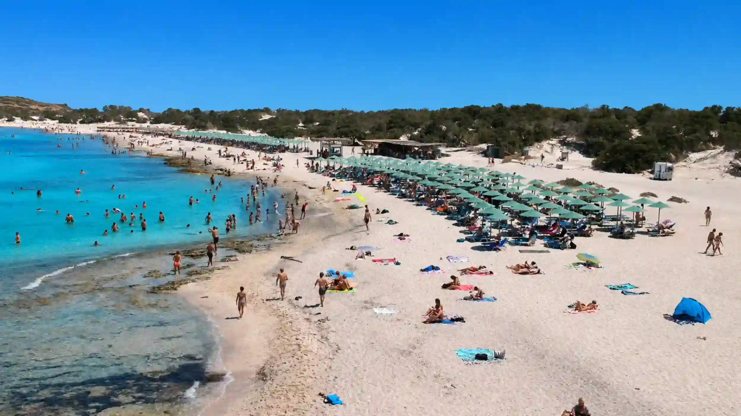 Rows of green umbrellas line Golden Beach on Chrissi Island from Ierapetra.