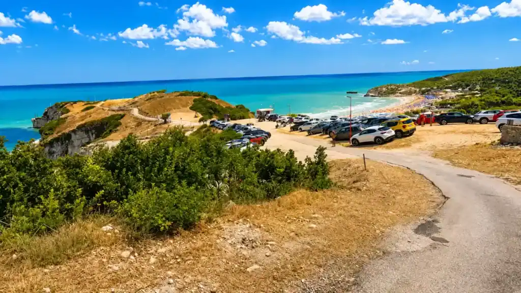 Coastal road and clifftop car park above Baia di Zaiana beach near Peschici.