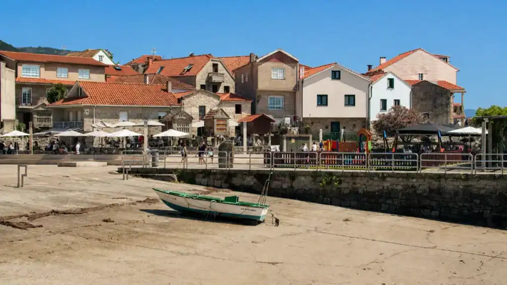 Small boat on tidal flats at Combarro waterfront, a highlight of days in Rías Baixas