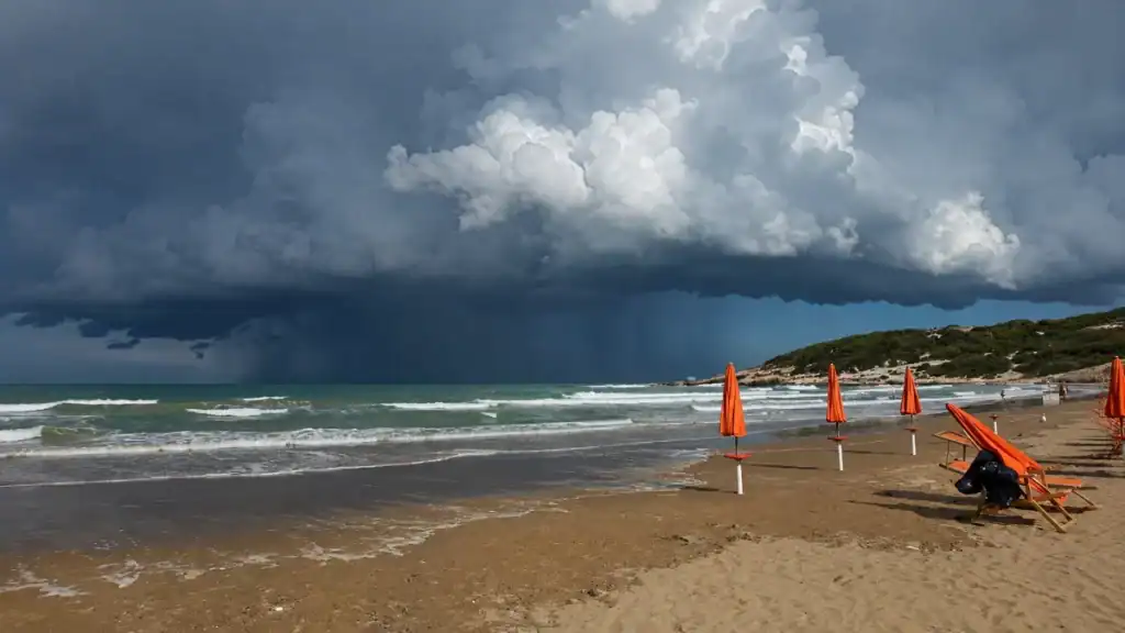 Orange parasols on Peschici beach in October