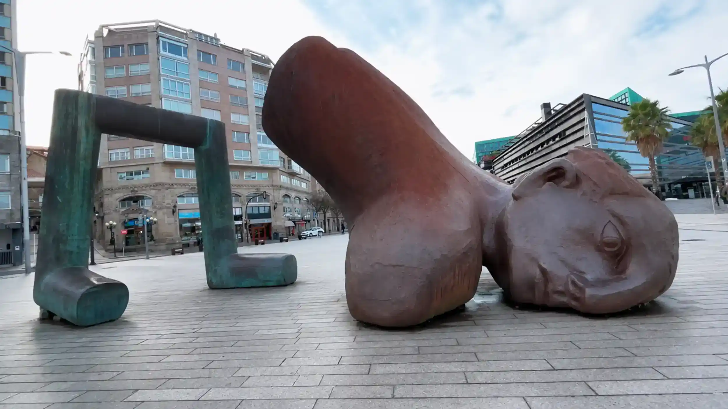 El Nadador sculpture lying on the granite promenade in Vigo during October on the Rías Baixas