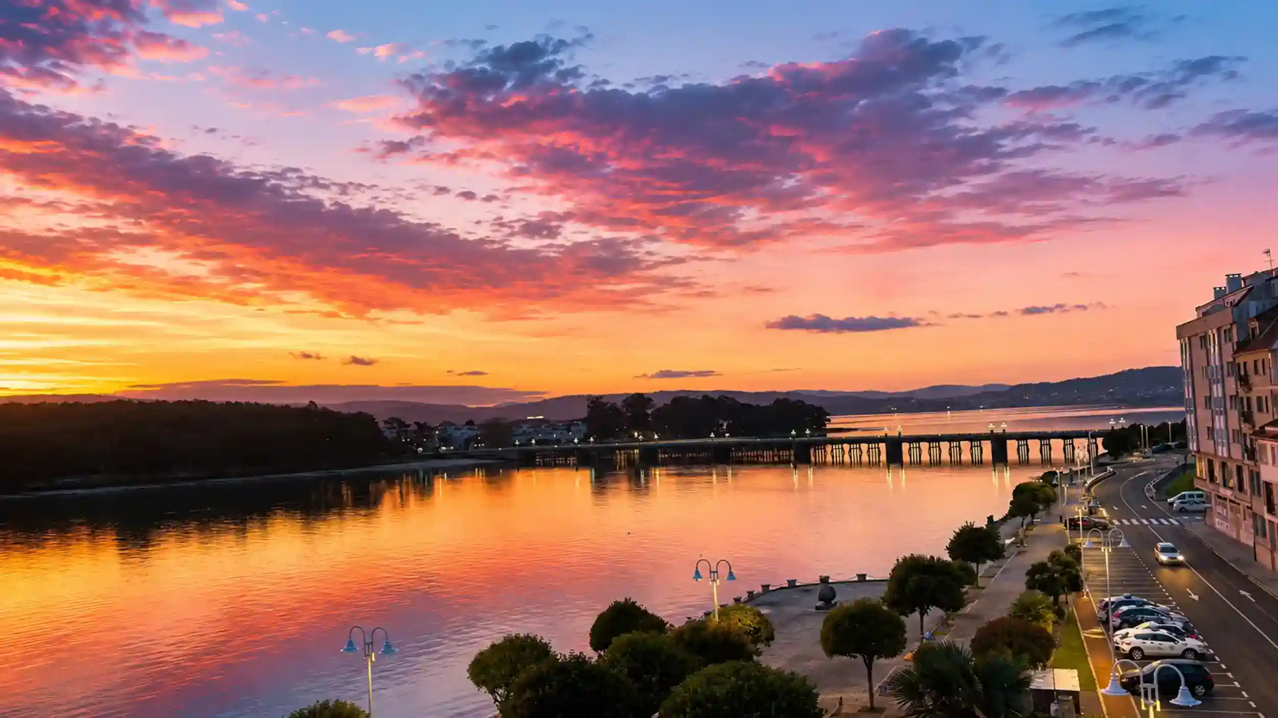 Fiery sunset over the estuary linking O Grove and La Toja island bridge, Galicia