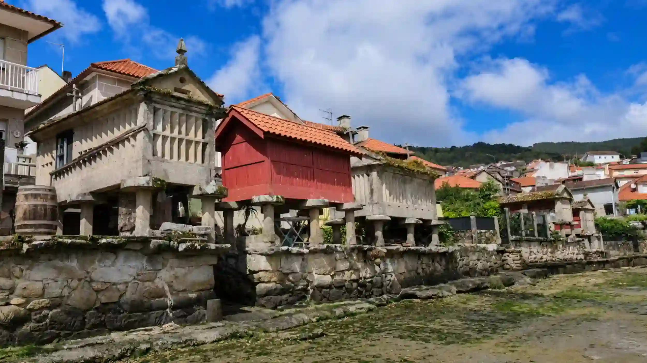 Stone hórreos lining the waterfront at Combarro on a road trip through RÃas Baixas