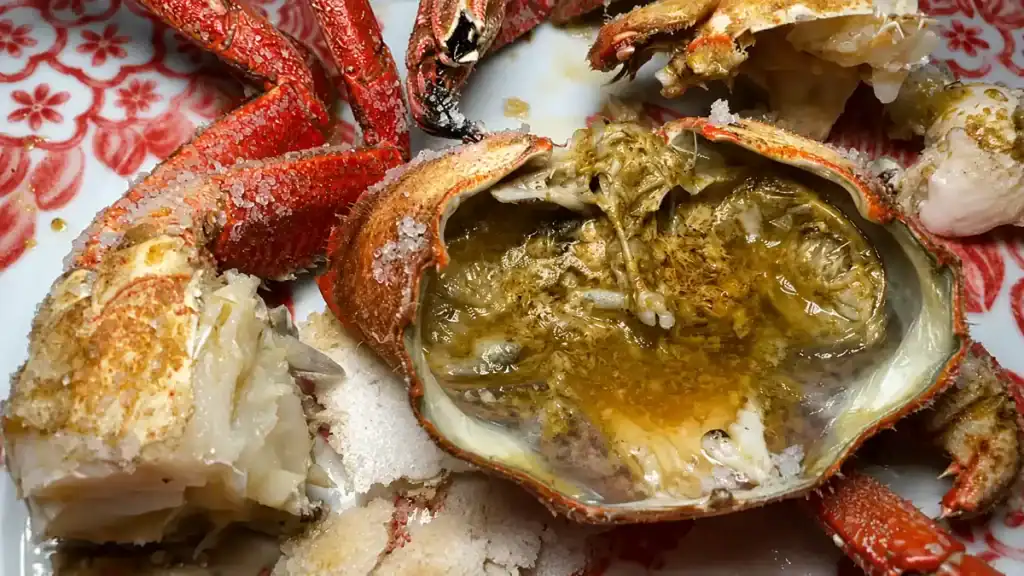 Freshly cooked spider crab split open on a patterned plate at dBerto restaurant in O Grove