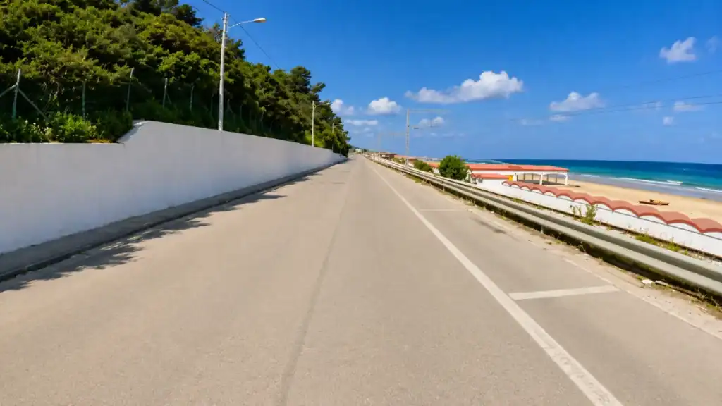 Empty coastal road running alongside the sandy beach at Rodi Garganico.