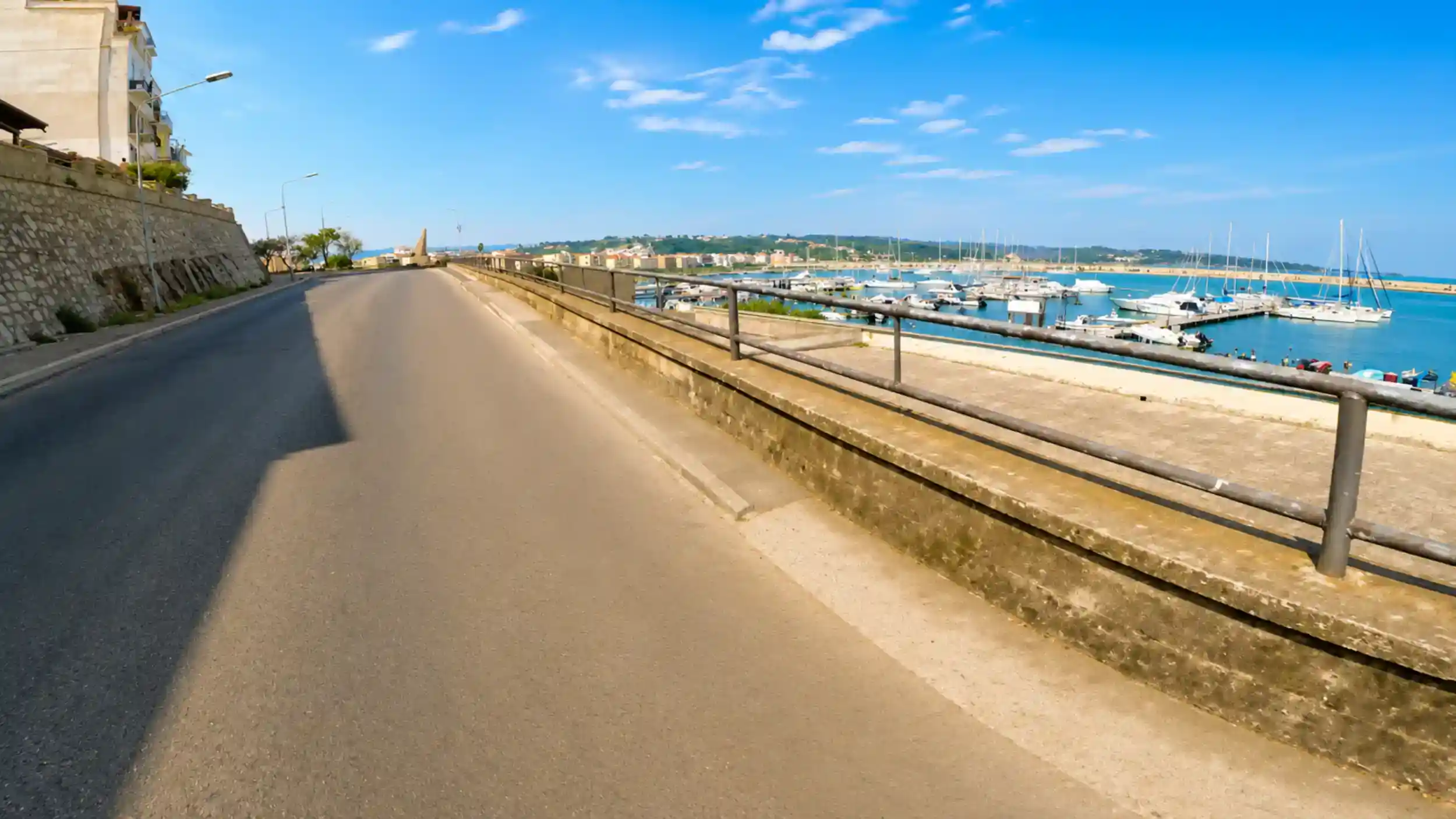 Coastal road leaving Vieste marina at the start of the Vieste to Peschici drive.