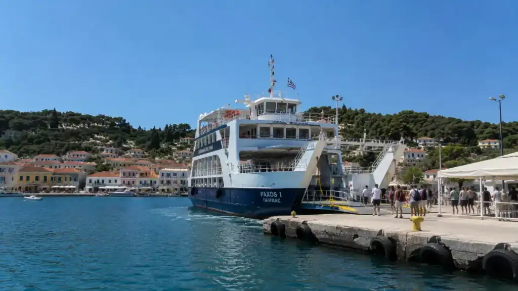 The Paxos I ferry lowering its ramp at Gaios dock as passengers disembark, a key arrival point for the best time to visit Paxos