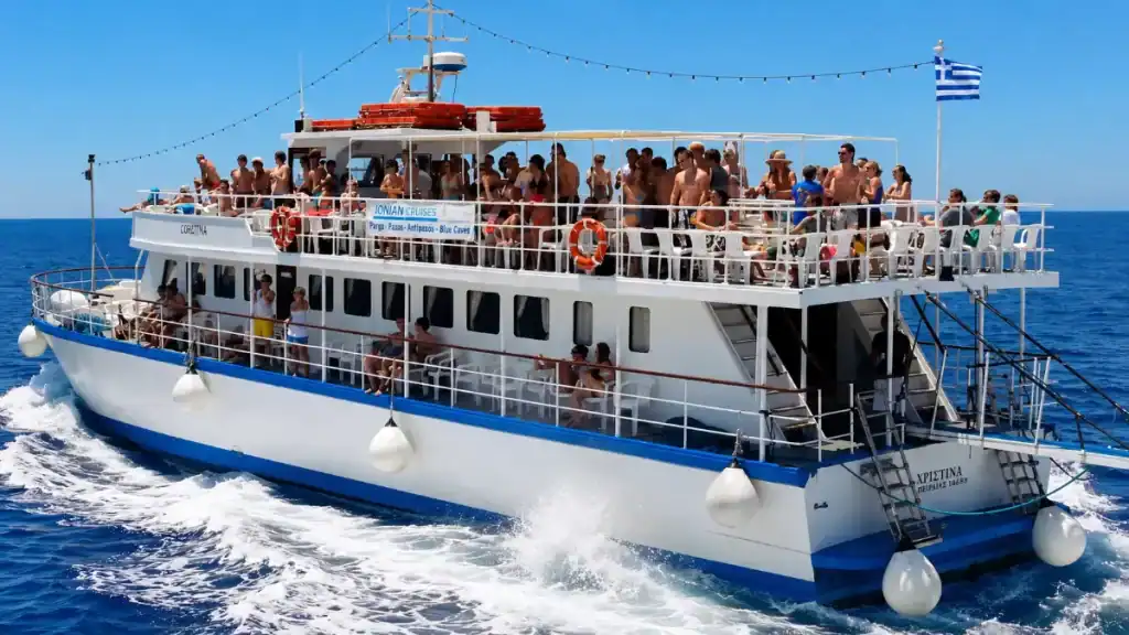 Passengers crowd the upper deck of an Ionian Cruises ferry crossing from Corfu.