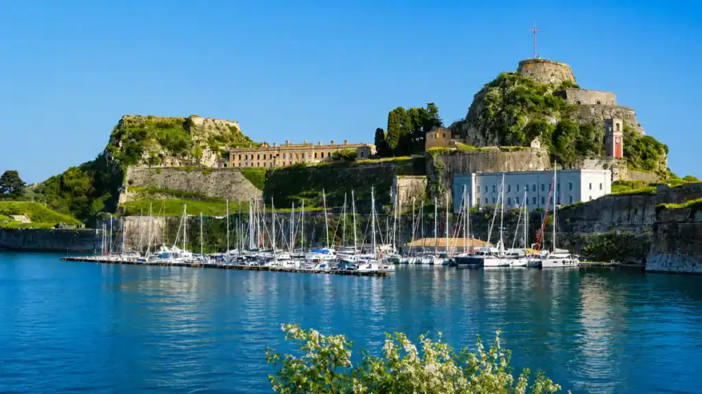 Yachts line the marina below the Old Fortress ramparts in Corfu Town