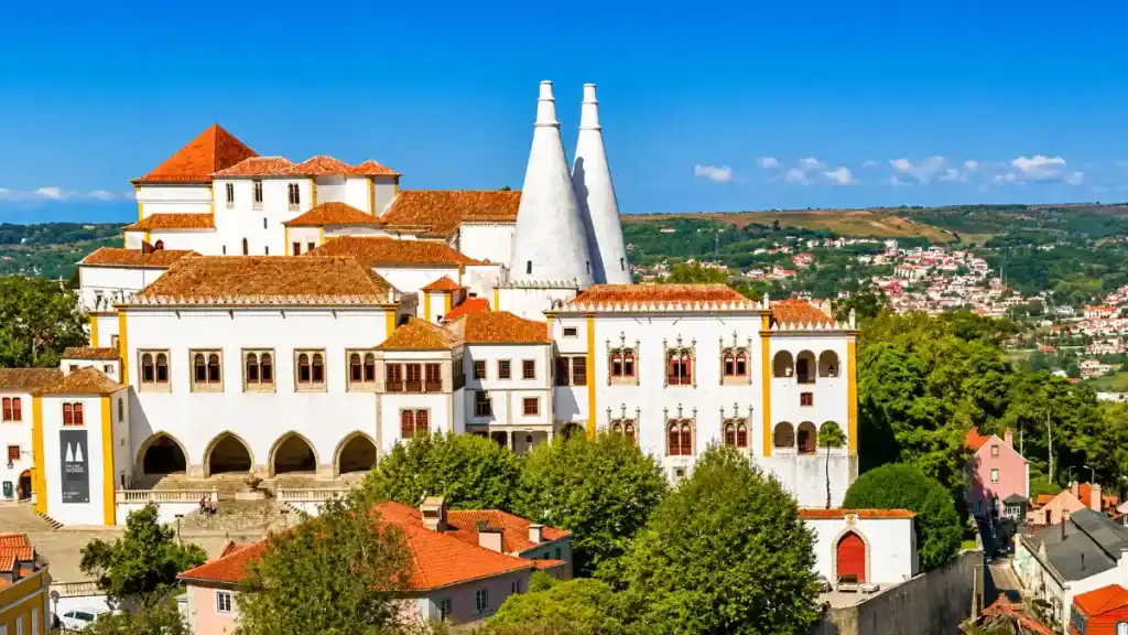 Twin conical chimneys of Sintra National Palace rising above the town rooftops, among the most recognisable places around Sintra