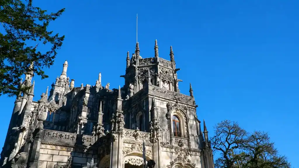Gothic spires and carved stonework crown the Quinta da Regaleira palace tower.