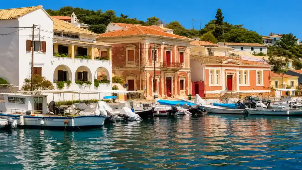 Fishing boats moor beneath Venetian mansions along the Gaios waterfront.