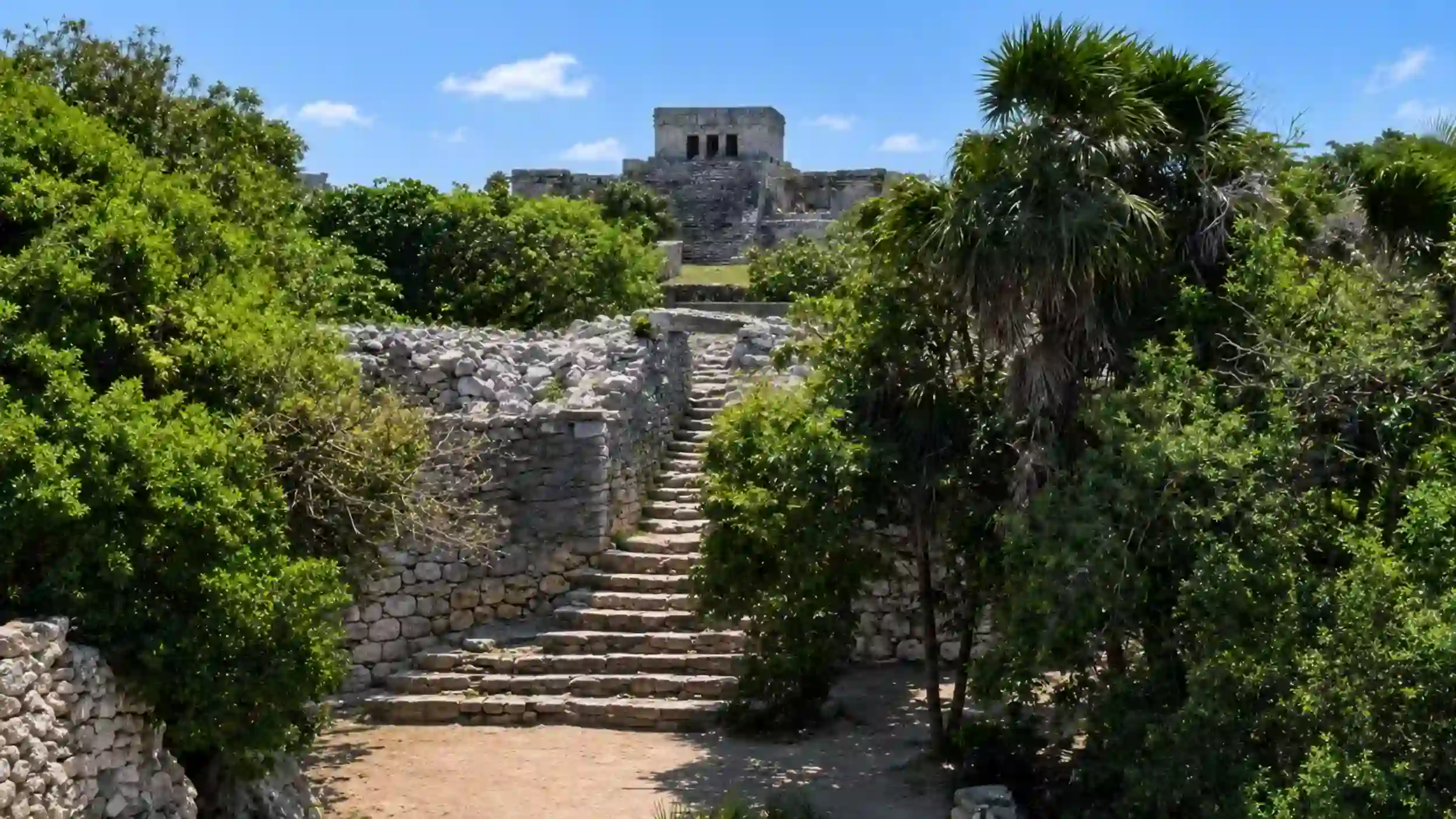 Stone stairway leads to El Castillo temple, prompting many to ask if the Tulum ruins are worth visiting