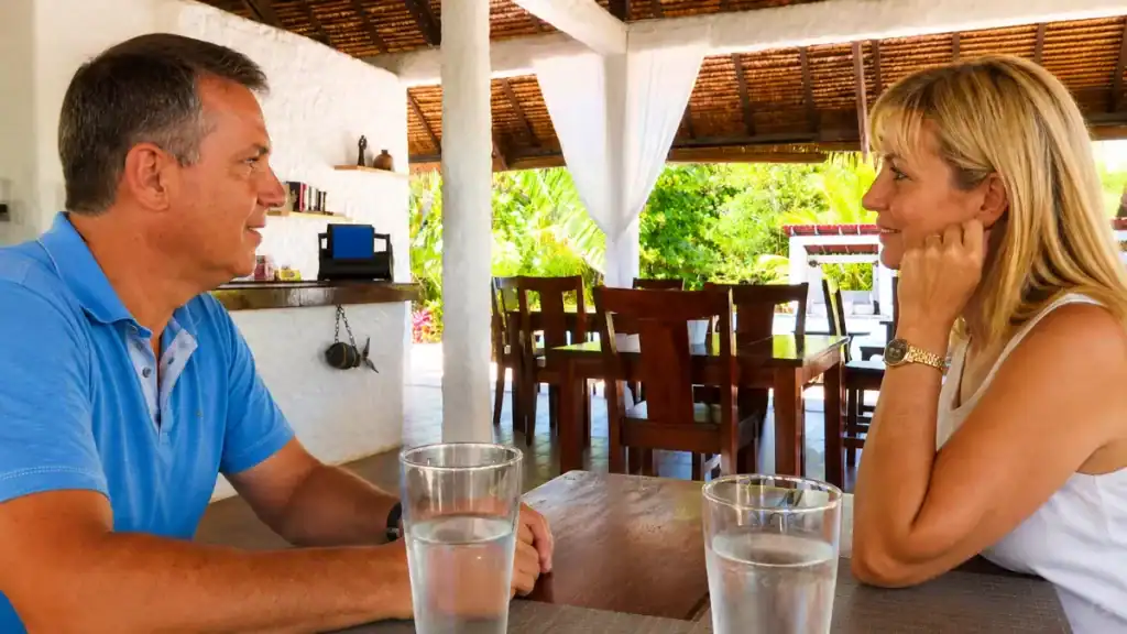 Guests chat over drinks under a thatched pavilion, proof Anda can be a day trip with a proper lunch stop.