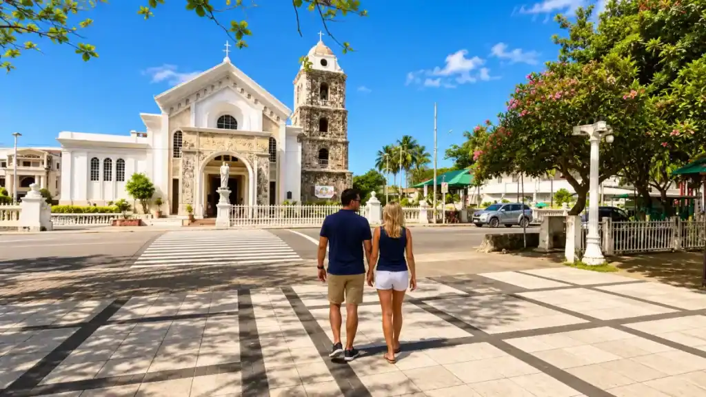 Couple crossing the plaza toward St. Joseph Cathedral, a Tagbilaran stop many wonder about when asking do you need a car in Bohol
