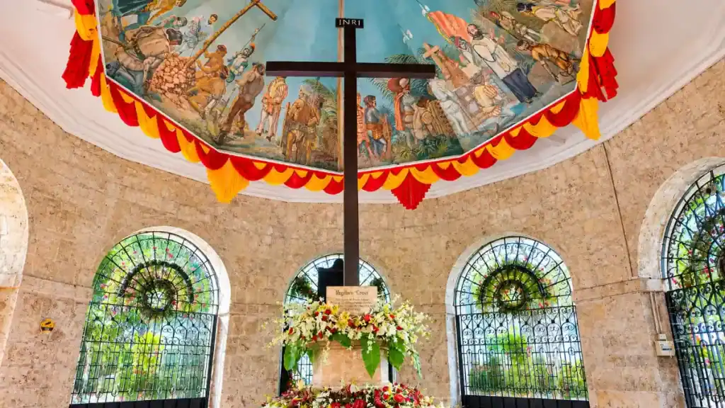 Wooden cross and painted ceiling mural inside the Magellan's Cross pavilion in Cebu