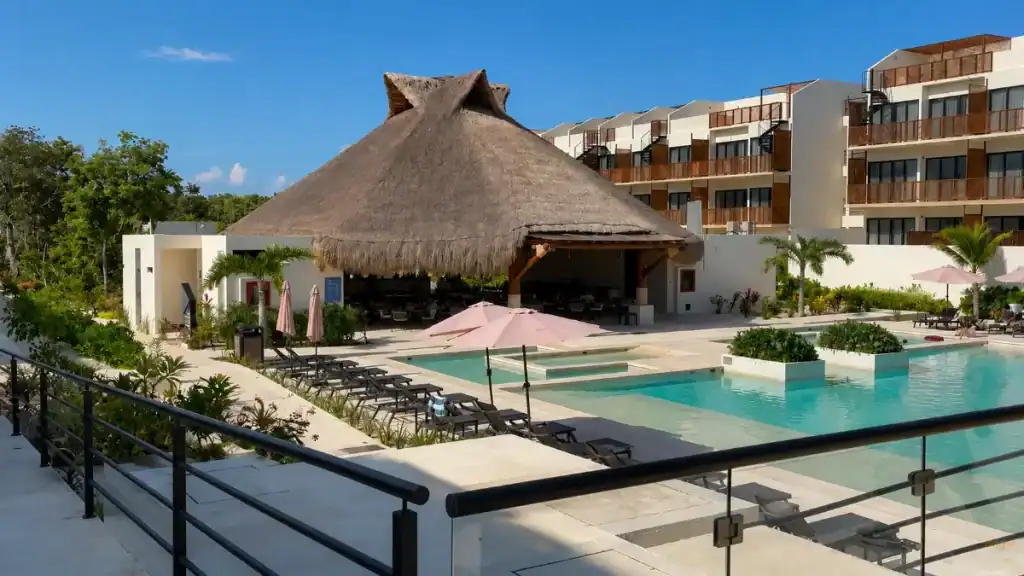 Thatched-roof restaurant overlooks the pool terrace at Wyndham Tulum resort.