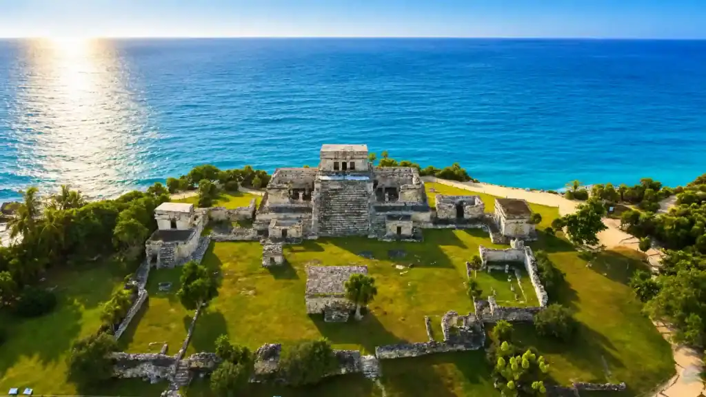 El Castillo ruins perched on Tulum's clifftop above turquoise Caribbean water, answering what is Tulum really like