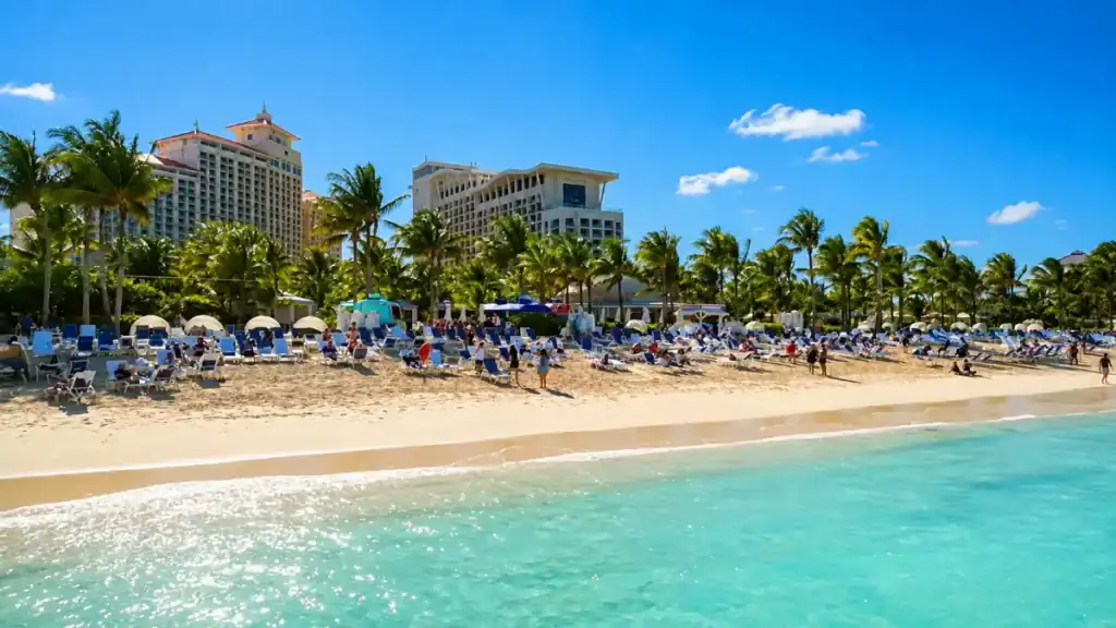 Rows of loungers fill Cable Beach in front of Nassau's resort towers