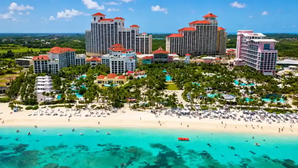Crowded beachfront resorts line Cable Beach, one reason Nassau is worth visiting