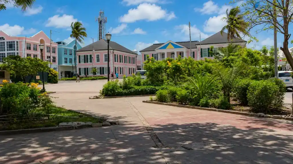 Colorful colonial buildings line a quiet plaza in downtown Nassau