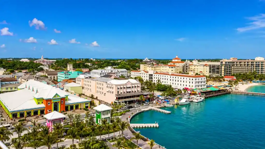 Aerial view of downtown Nassau's harbourfront near Prince George Wharf, packed with colorful rooftops.