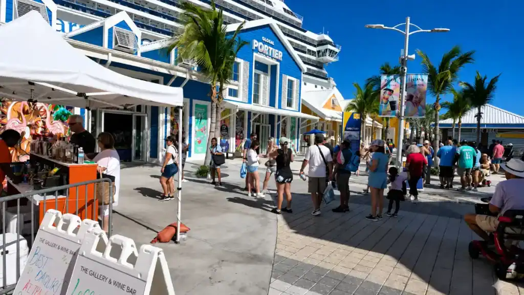 Cruise passengers browse vendor stalls at Prince George Wharf near the Global Portier building in Nassau.
