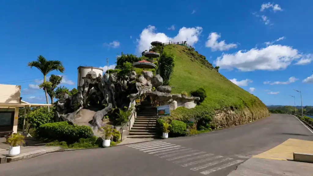 Stone steps and a rocky grotto lead up to a Chocolate Hills viewpoint platform.