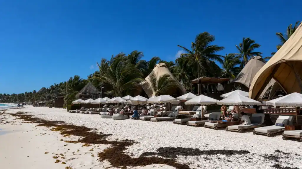 Sunbeds and tented cabanas at Tiki Tiki beach club show who Tulum is really for