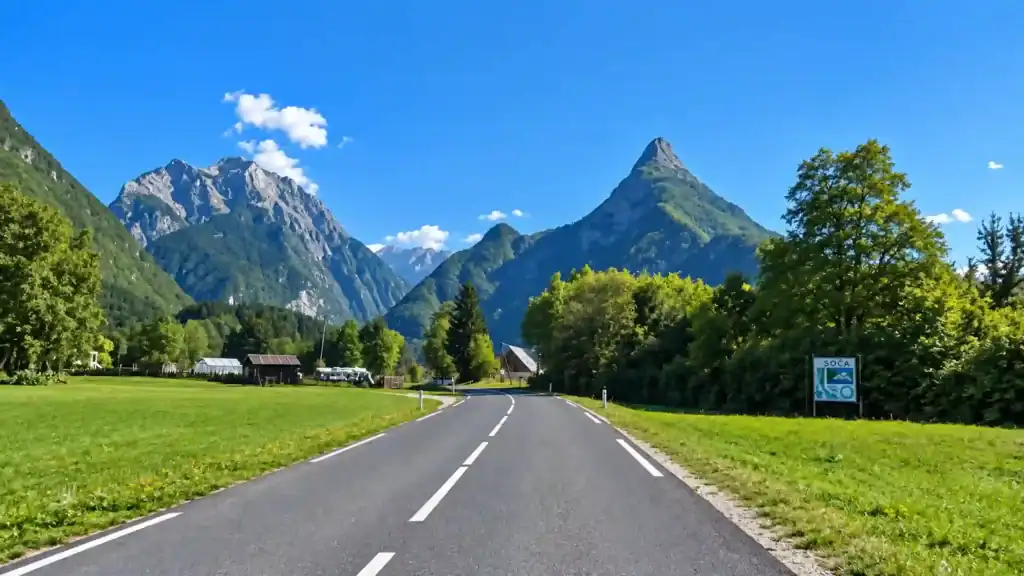The open road into Soča village signals the descent from Vršič Pass, part of what makes people ask is Vršič Pass worth visiting