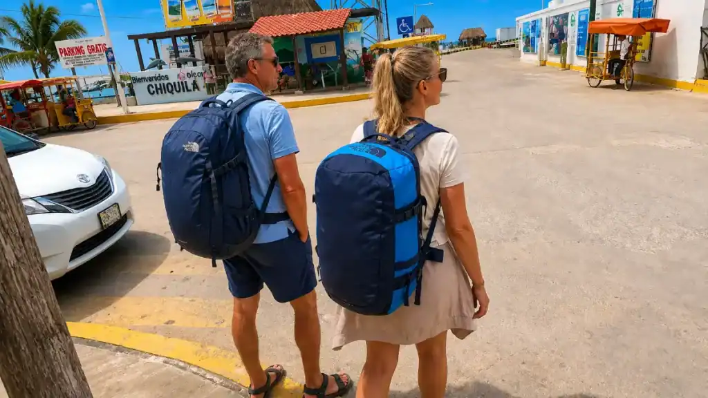 Backpackers arriving at the Chiquilá parking area near the ferry port