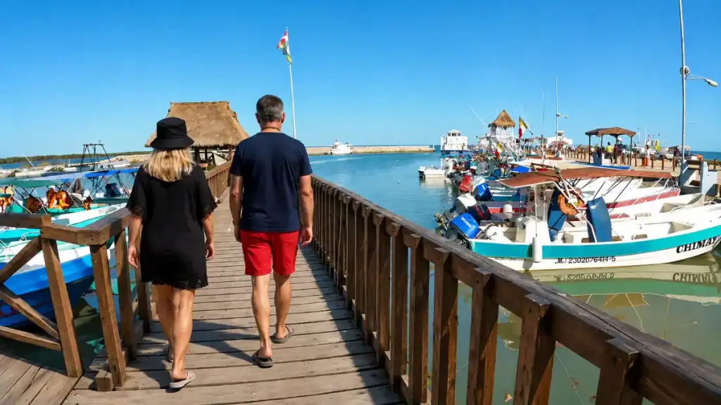 Couple walking the dock at Chiquilá ferry terminal, gateway for a Holbox day trip