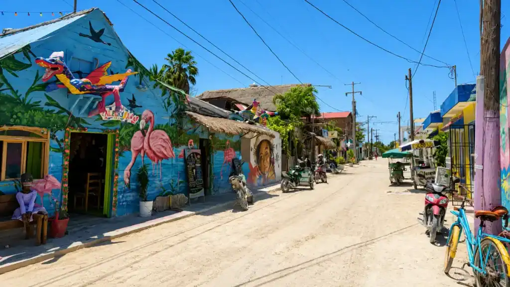 Flamingo mural on a Holbox town facade, best time to visit Holbox to see its colorful streets