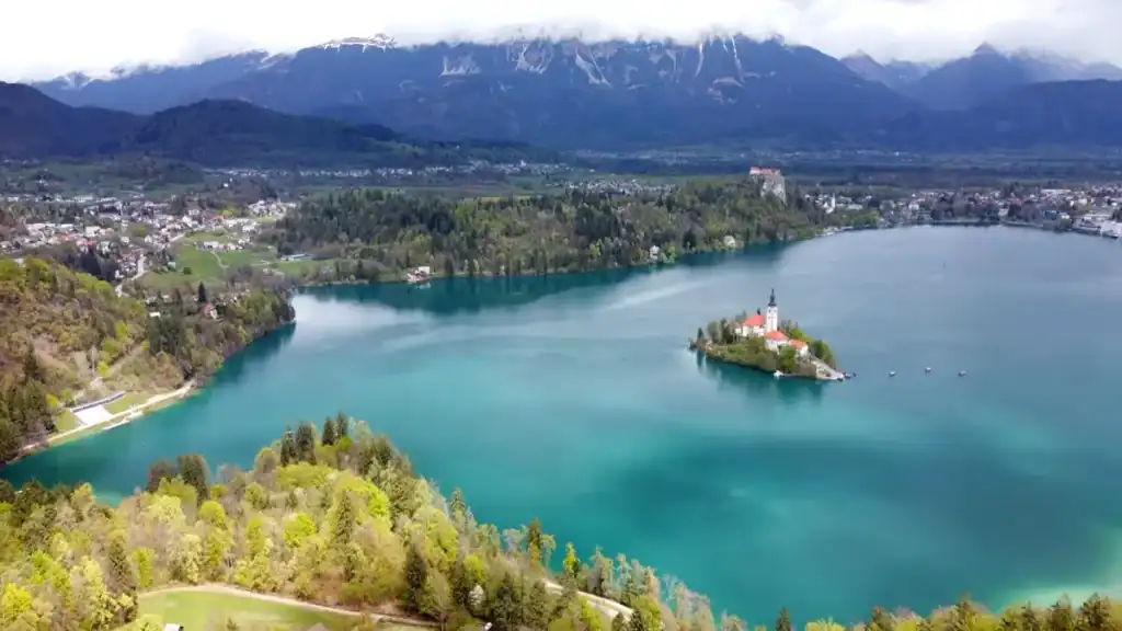 Aerial view of Lake Bled's island church, a popular day trip from Kranjska Gora