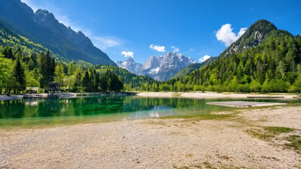 Emerald waters of Lake Jasna beneath the Julian Alps near Kranjska Gora, worth visiting for the view alone
